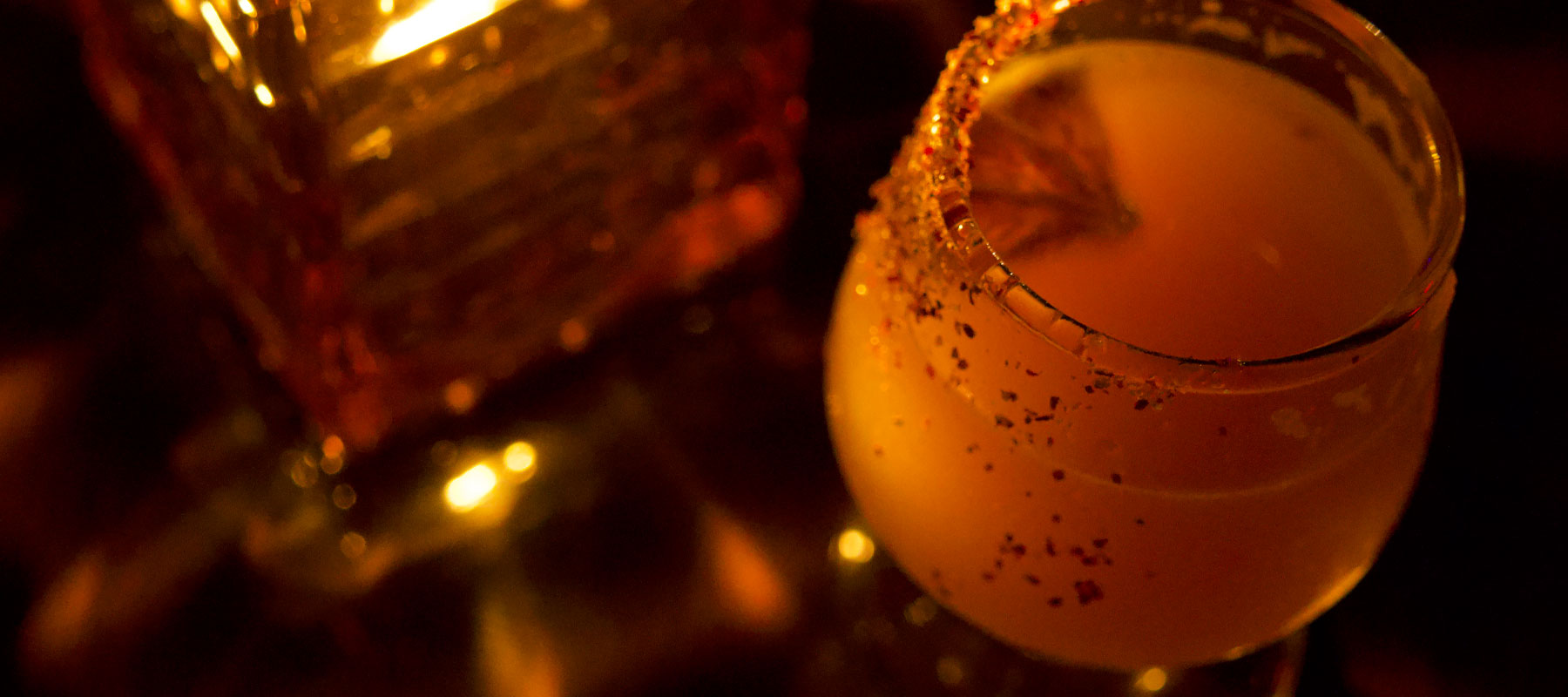 Craft cocktail served by candlelight at a Beverly Hills tasting stop