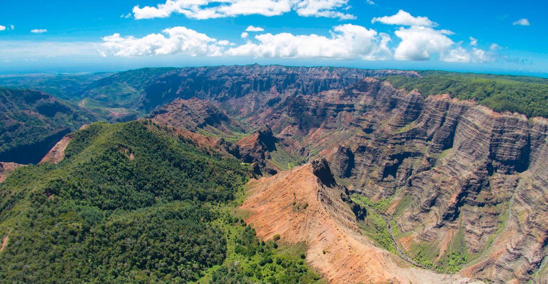 Enjoy aerial views of Waimea Canyon, known as "The Grand Canyon of the Pacific"