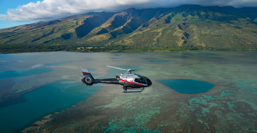 Soar over the scenic waters between Maui and Molokai
