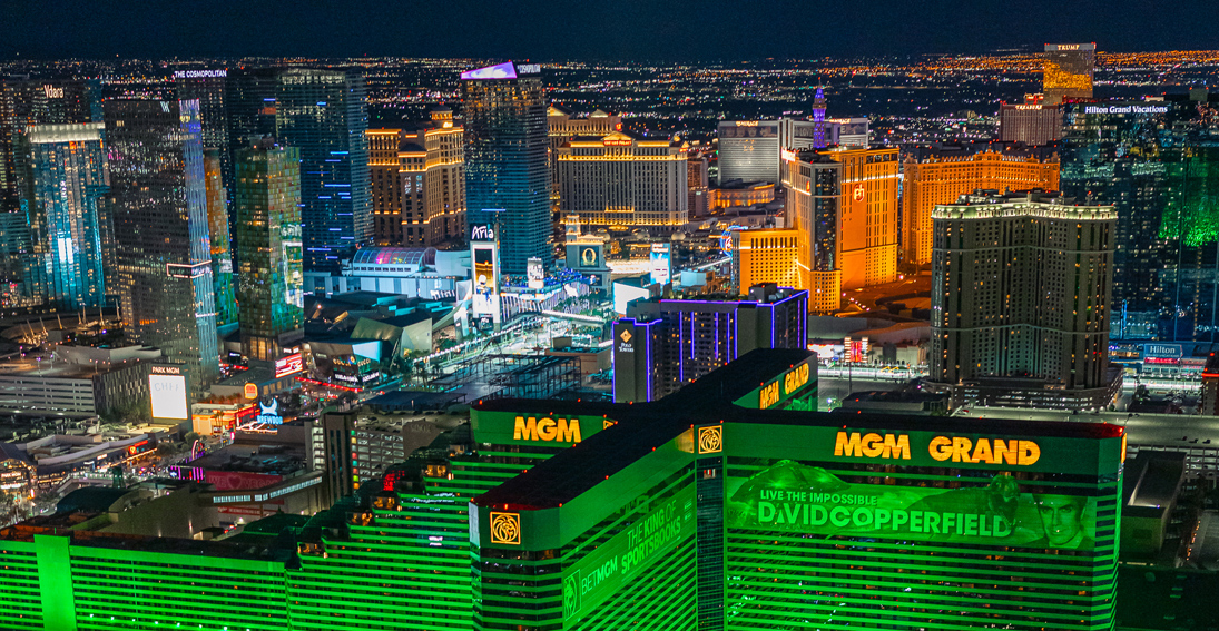 See the neon green of the famous MGM resort and casino as you soar over the Vegas Strip