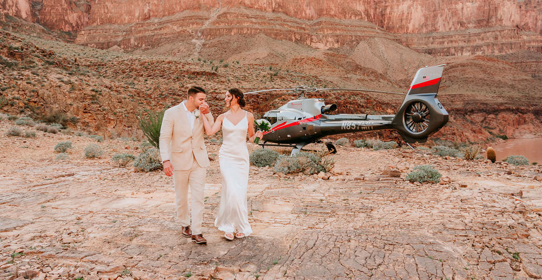 Couple deeply in love at their Grand Canyon wedding ceremony with a luxury helicopter arrival