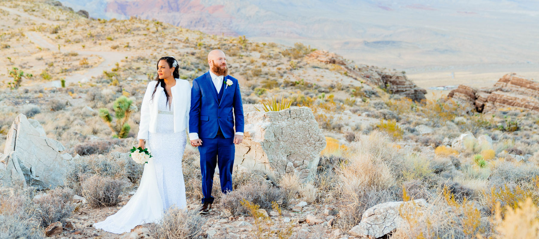 A happy couple celebrating their Desert Enchantment helicopter wedding near Las Vegas