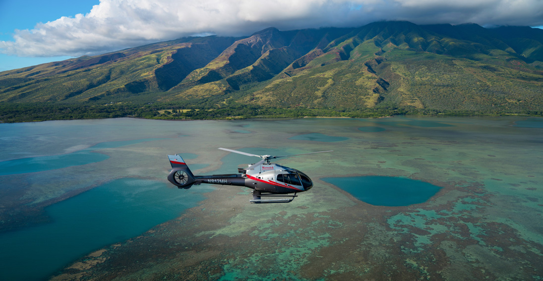 Enjoy aerial views of Molokai during your Maui wedding