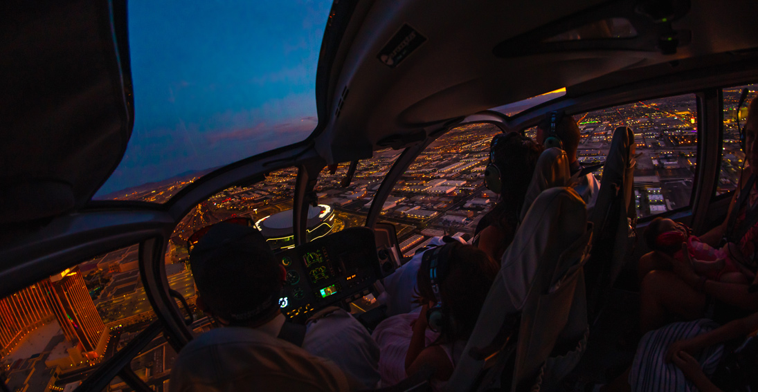 Neon views of the Vegas Valley during this wedding helicopter flight